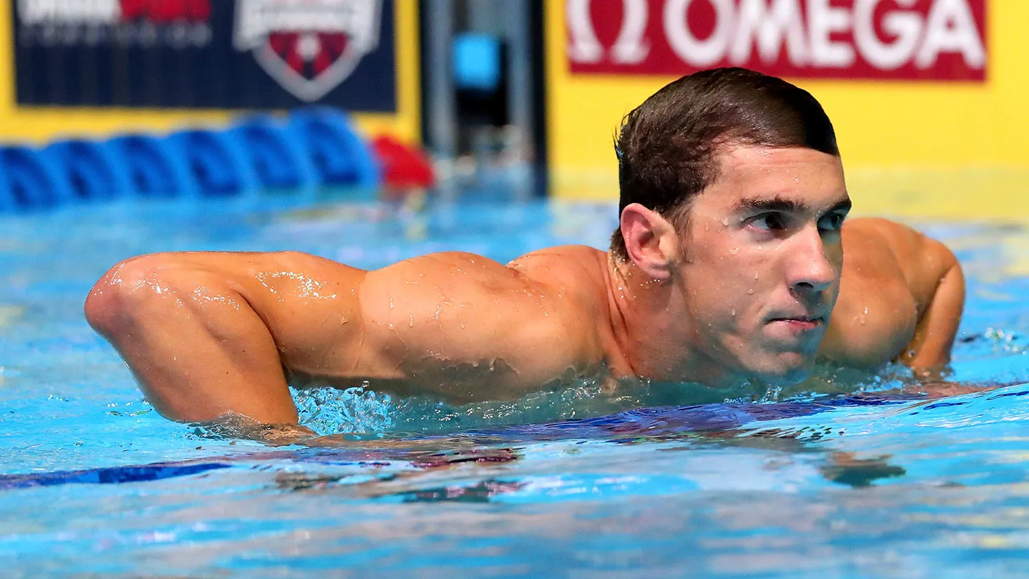 Michael Phelps of the U.S. celebrates after finishing first in the final heat for the Men's 100 Meter Butterfly during Day Seven of the 2016 U.S. Olympic Team Swimming Trials on July 2, 2016, in Omaha, Nebraska.
