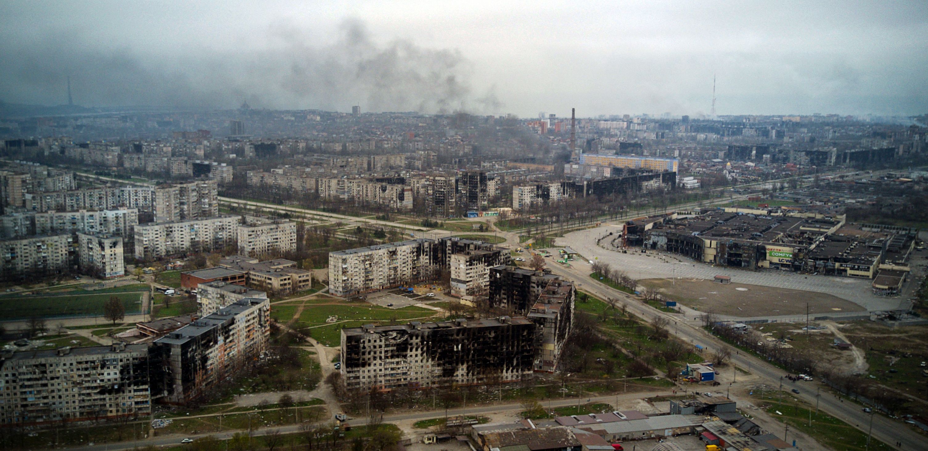 Smoke rises near destroyed residential buildings in Mariupol, Ukraine.