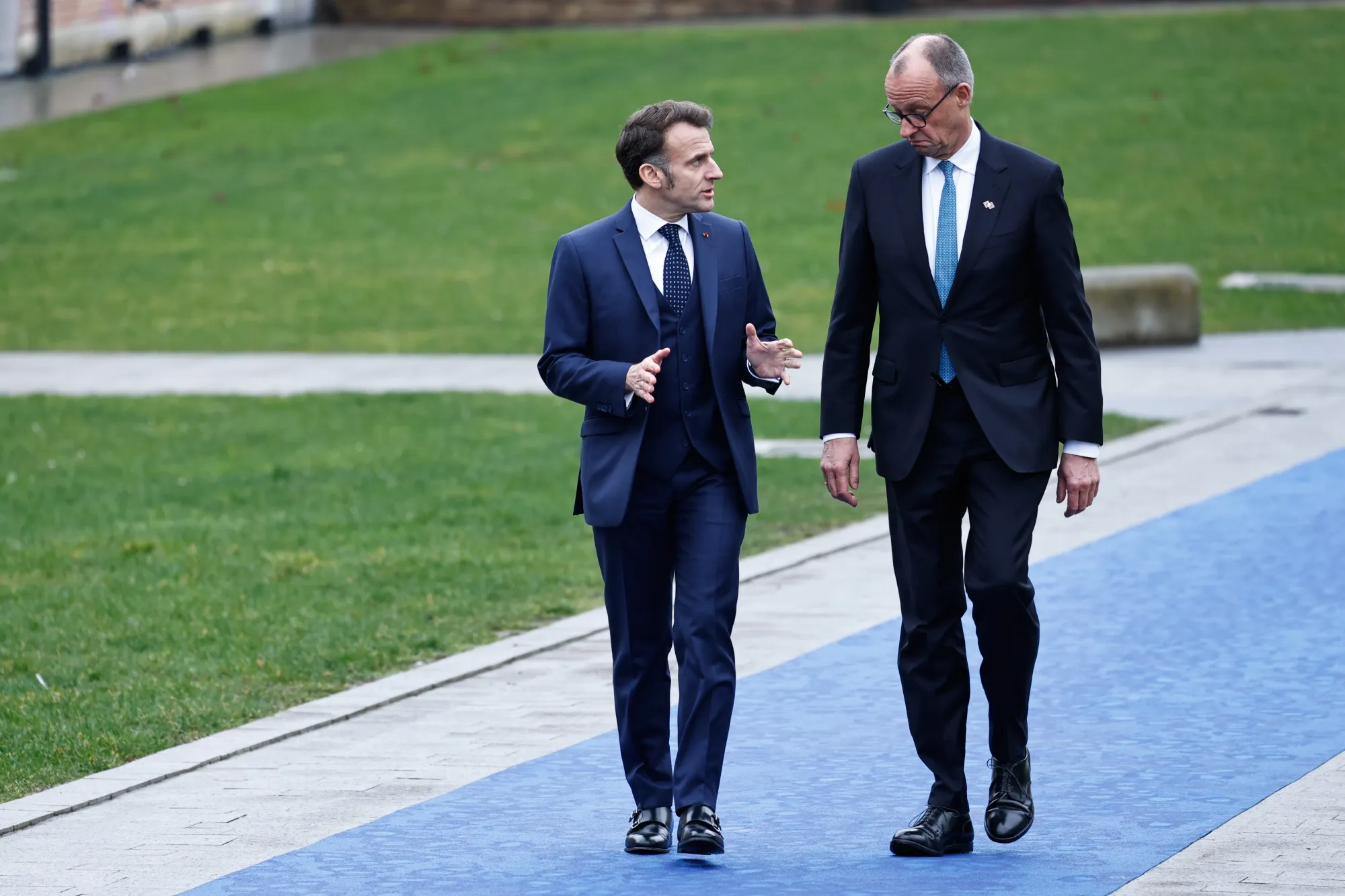 Macron and Merz arrive at an informal EU leaders’ retreat on Thursday, Feb. 12, 2026. 