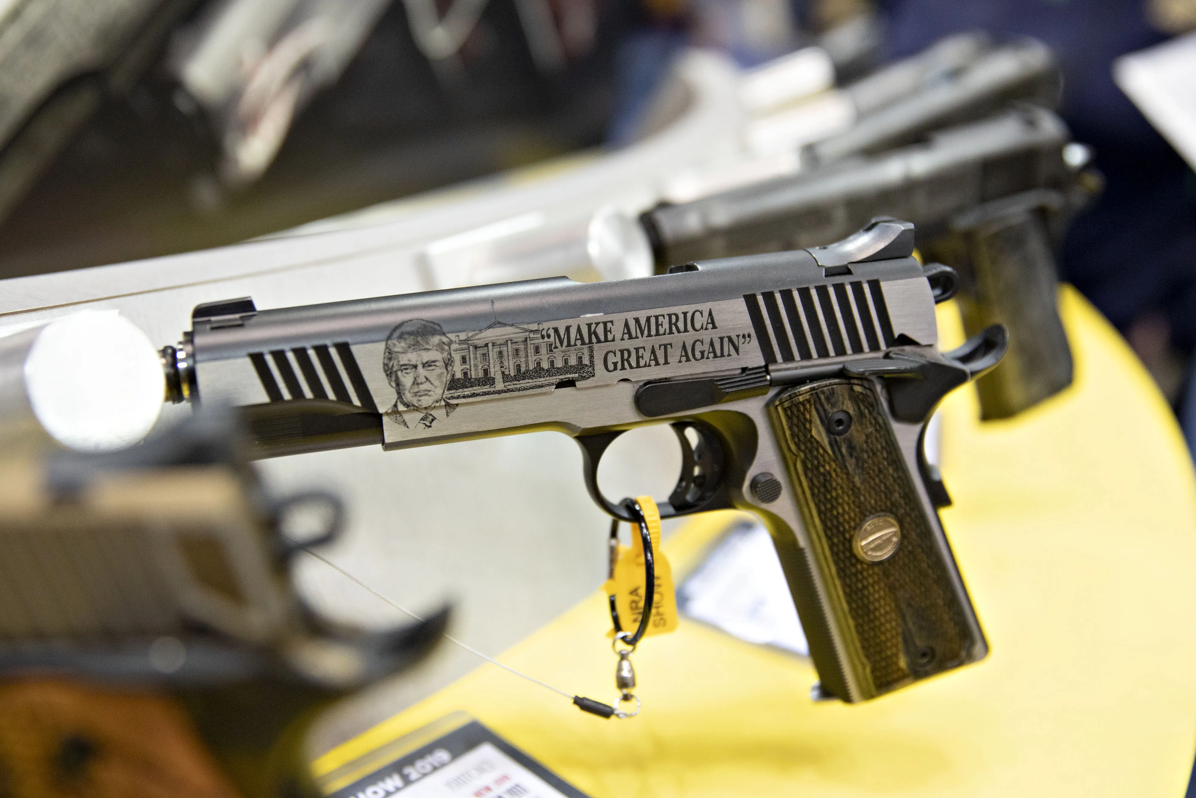 A handgun featuring the image of President Trump during the NRA annual meeting.