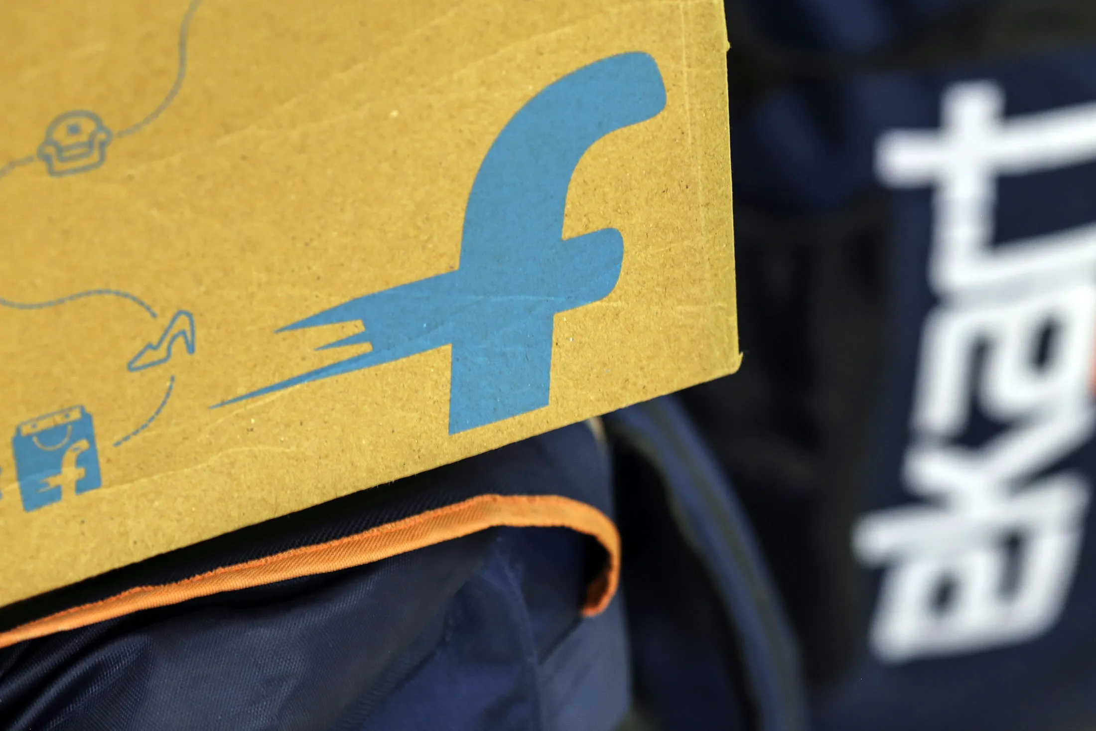 The logo of Flipkart Online Services Pvt is seen on the side of a package at the company's office in the Jayaprakash Narayan Nagar area of Bengaluru, India, on Wednesday, Oct. 26, 2016. Flipkart, India's largest and most valuable e-commerce company, is against domestic rival Snapdeal.com and U.S. leviathan Amazon.com Inc., all tussling for dominance in a market that Morgan Stanley expects to explode more than ten-fold to $137 billion by 2020 from $11 billion in 2013.
