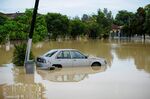 A car in floodwaters in Malaysia’s southern coastal state of Malacca in Jan. 2022.
