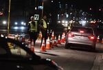 LAPD police check drivers at a DUI checkpoint in Reseda, Los Angeles, California on April 13, 2018.