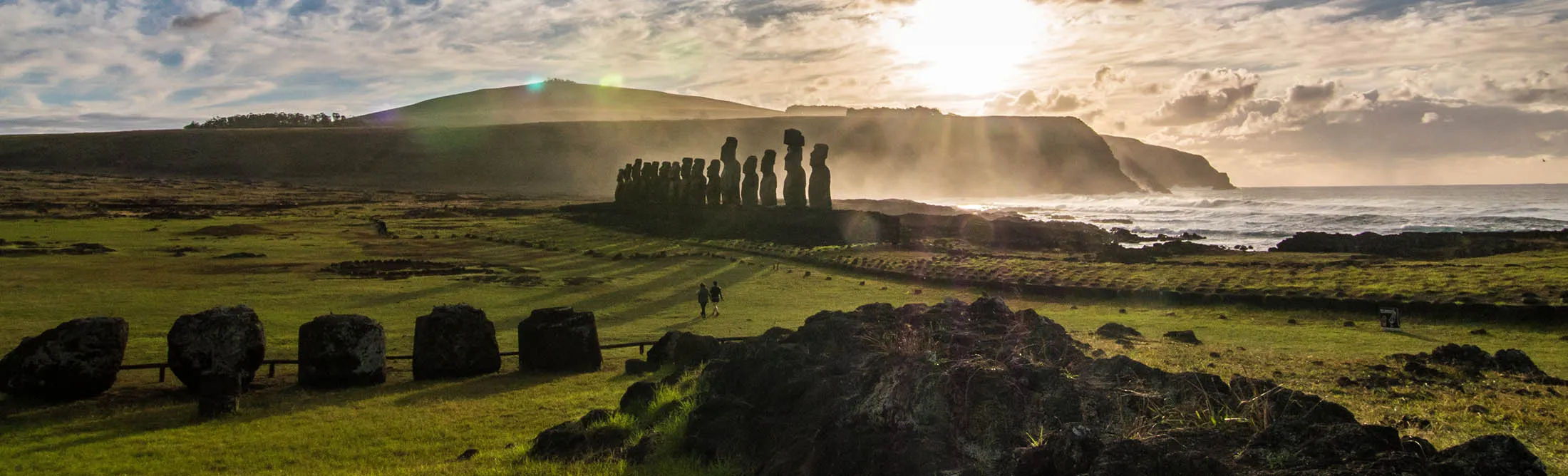 Two tourists visit the moais among the beautiful landscape of Rapa Nui, in the Pacific Ocean’s Polynesian Triangle. Rapa Nui is a Unesco World Heritage Site.
