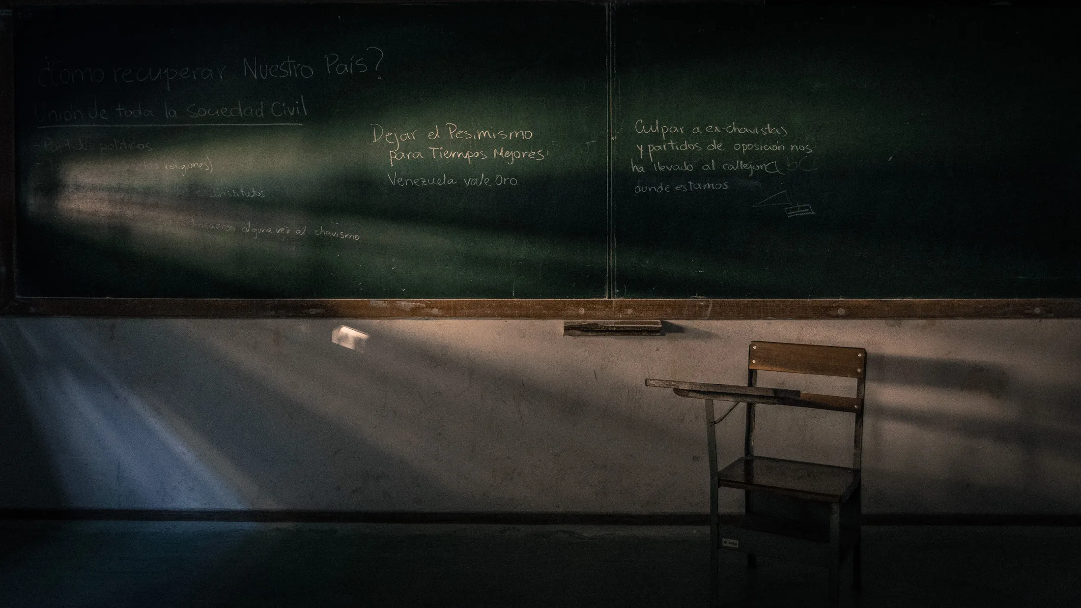 Scrawled on a classroom blackboard: “Let's leave pessimism for better times. Venezuela is worth gold.'' “Blaming ex-chavistas and opposition parties has brought us to this dead-end we're in.''