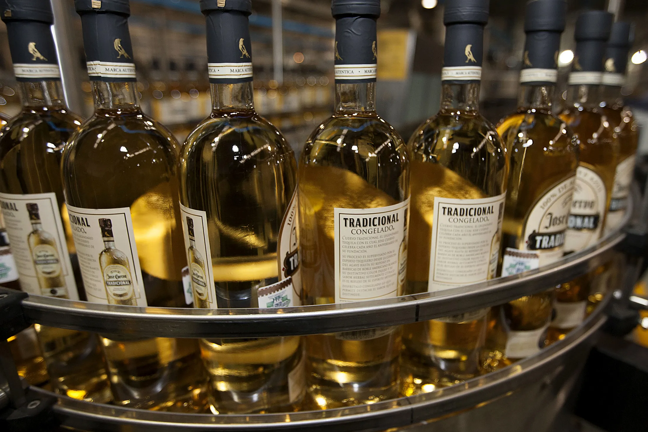 Bottles of José Cuervo Tradicional Tequila on the transportation band at a bottling factory in Guadalajara, Mexico.
