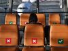 A passenger sits in socially-distanced seats at the gates in a near-empty Suvarnabhumi International Airport in Bangkok on June 3, 2020, as domestic Thai travel starts to pick up following restrictions to halt the spread of the COVID-19 coronavirus. (Photo by Lillian SUWANRUMPHA / AFP) (Photo by LILLIAN SUWANRUMPHA/AFP via Getty Images)