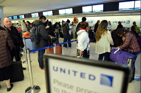United Airlines Passengers Check in at Kennedy International