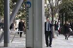 Pedestrians walk past the GranToko South Tower, which houses the Recruit Holdings Co. headquarters, in Tokyo, Japan, on Thursday, Feb. 14, 2019.