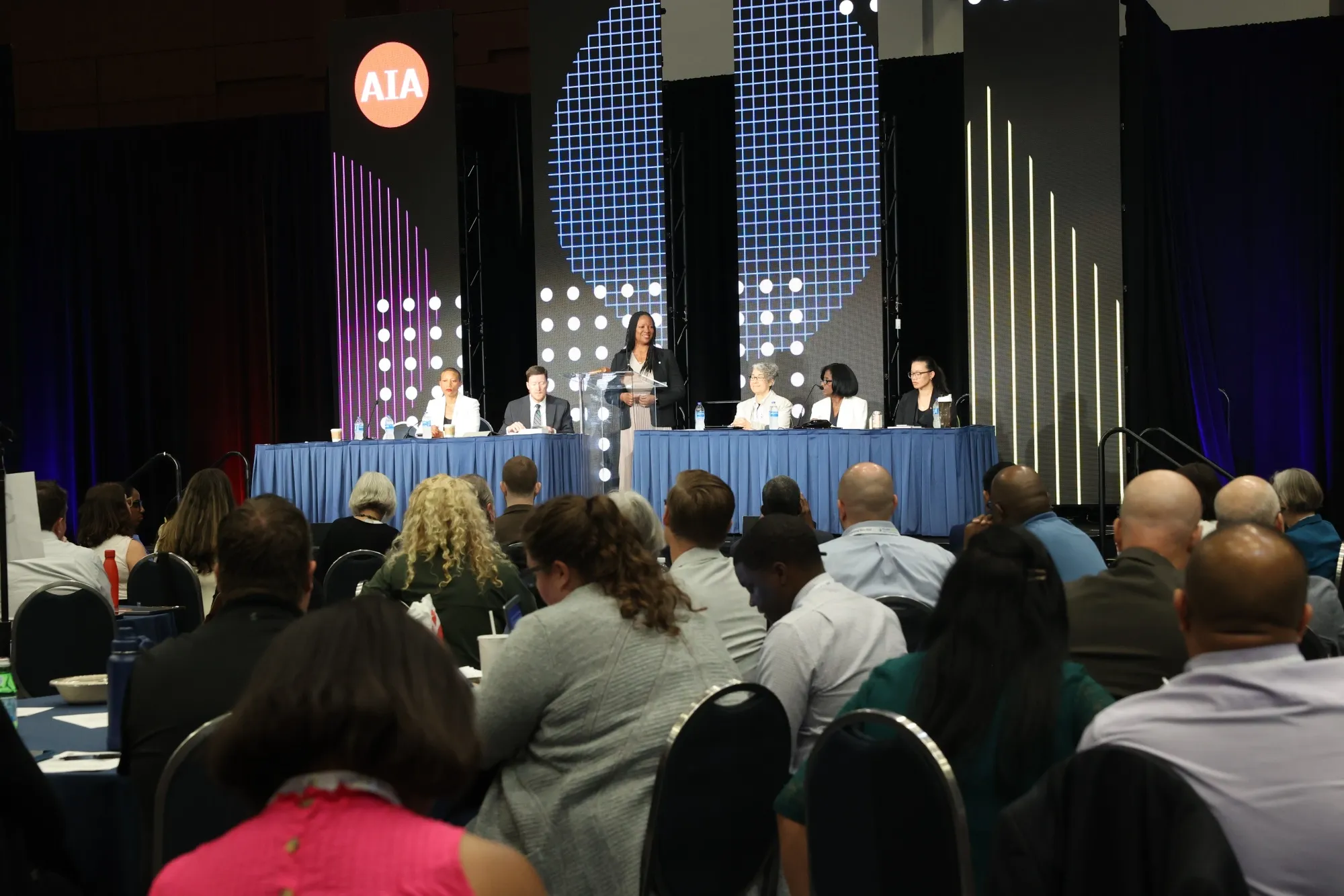&nbsp;Lakisha Ann Woods (center) stands with members of the&nbsp;American Institute of Architects board at the group’s national convening this week.&nbsp;