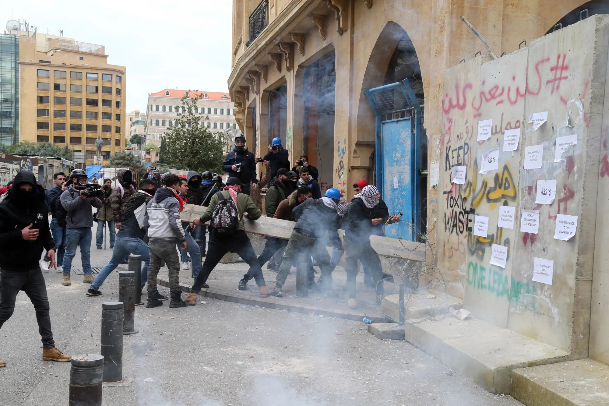 Protesters ram concrete barricades near parliament in Beirut, Lebanon, on&nbsp;Feb. 11.&nbsp;