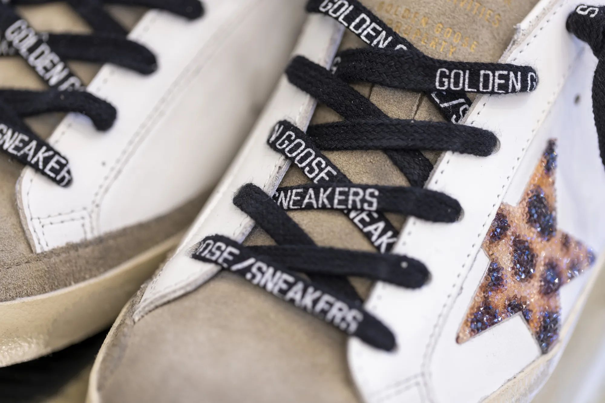 Branded cotton laces in a pair of sneakers at a Golden Goose store.