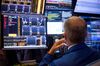 A trader works on the floor of the New York Stock Exchange (NYSE) in New York, U.S.