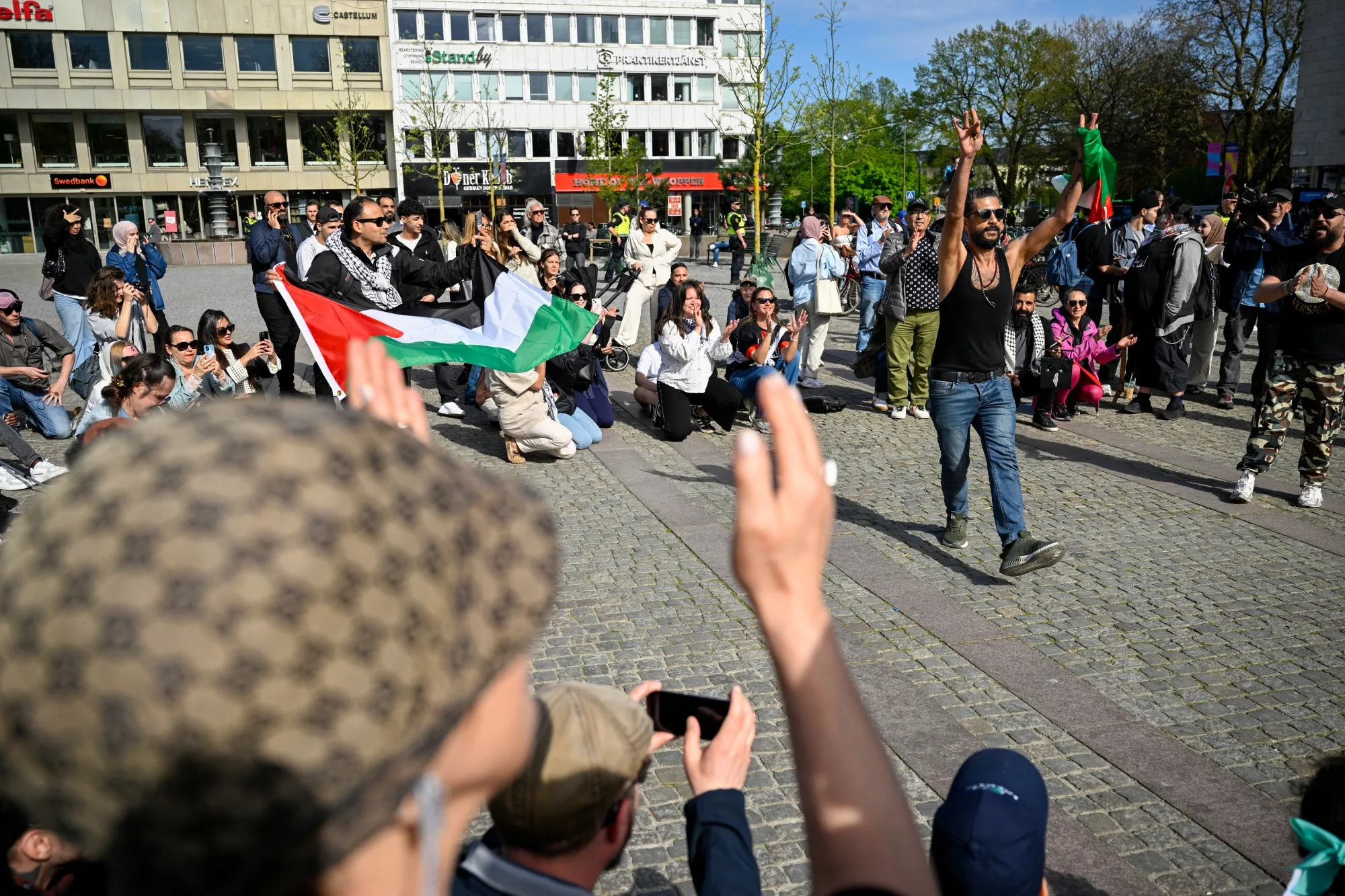 Counter-demonstrators&nbsp;at&nbsp;a public gathering where the organizers intend to burn a Koran, in Malmo, Sweden, on May 3.