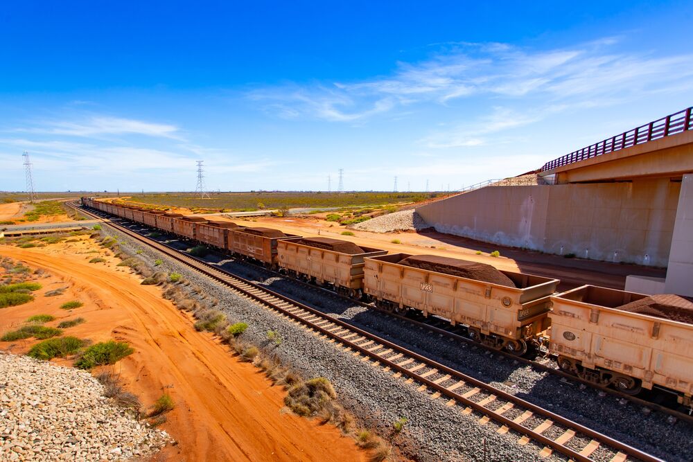 Wagons Of Iron Ore Make Their Way To Port By Rail And Road