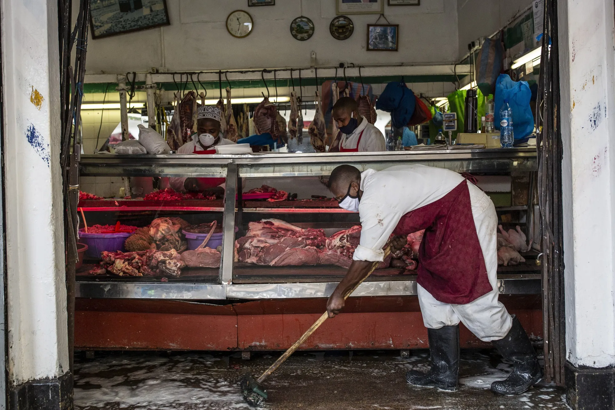 A butcher cleans the floor at Kenyatta Market in Nairobi on April 23.