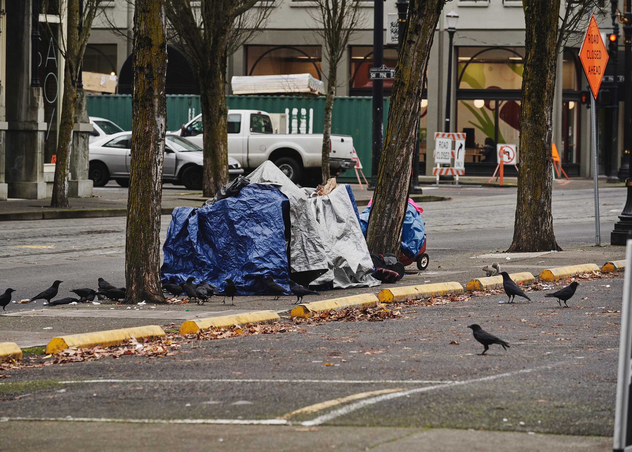 Man with belongings on SW 12th Ave. and SW Washington St., Portland, Ore.