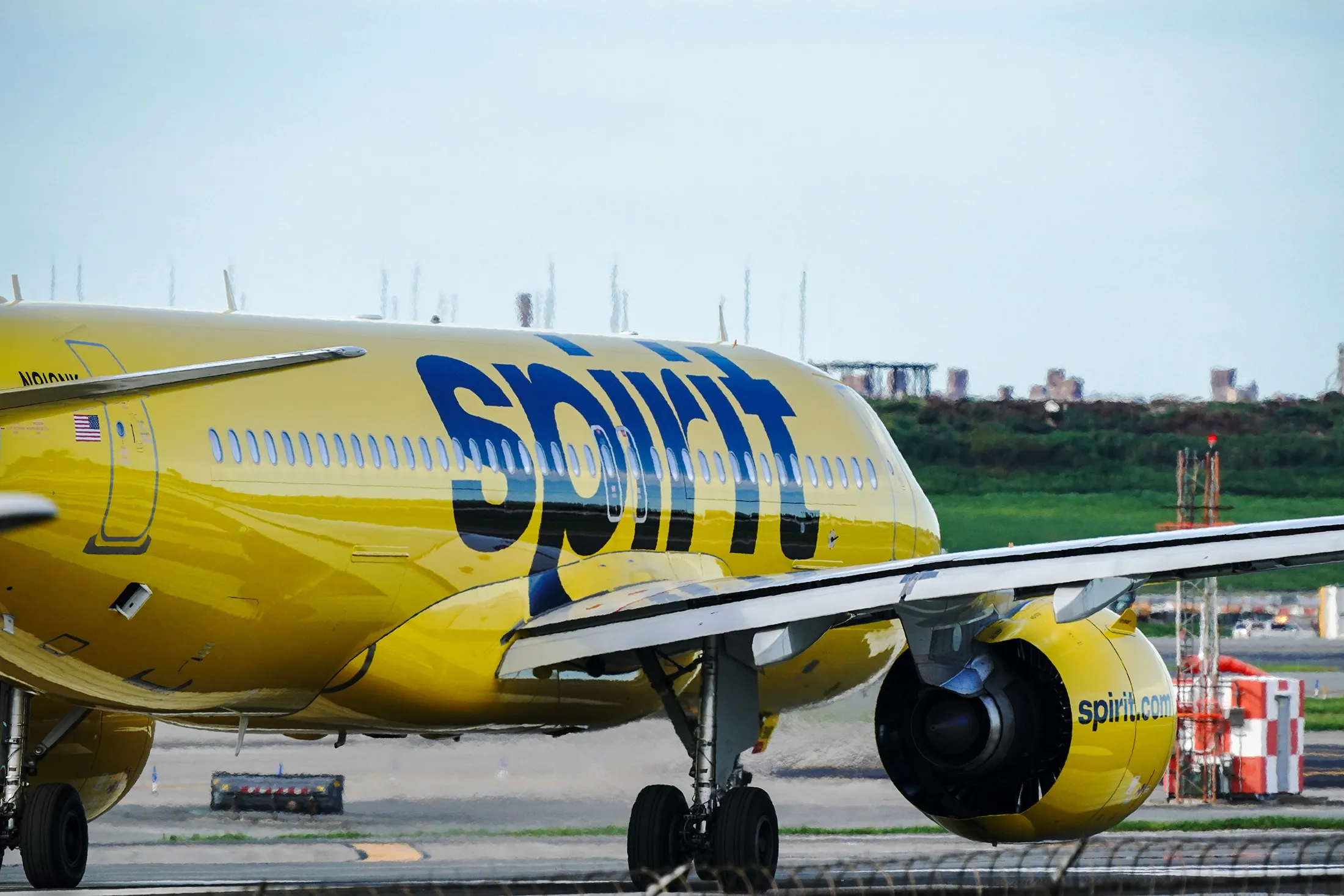 Spirit Airlines aircraft takes off at La Guardia Airport.