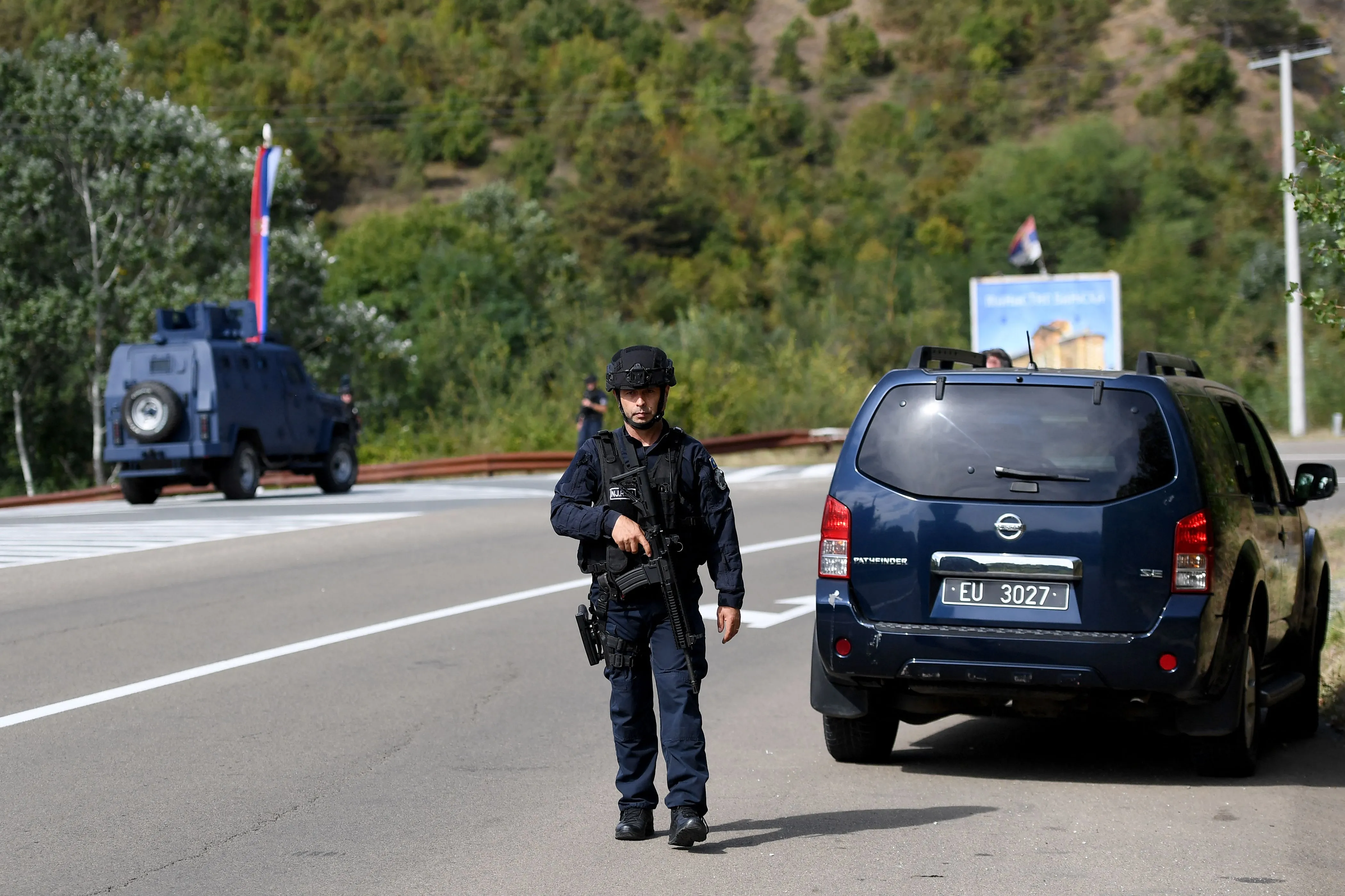 Kosovo police officers guard the entrance to the village of Banjska, on Sept.&nbsp;24.