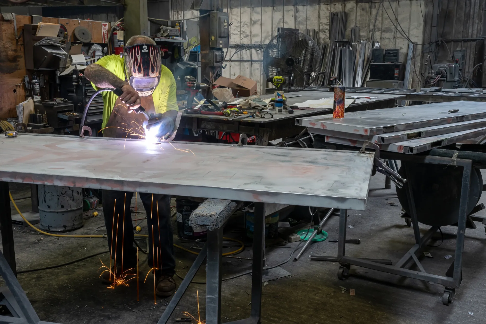 A worker arc welds a metal door during production at a manufacturing facility in Sacramento, California.