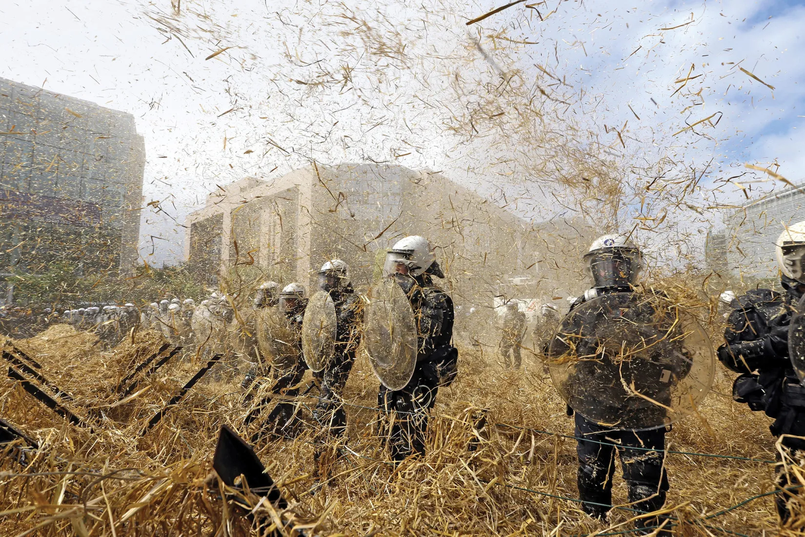 Police in Brussels confront protesting farmers who want relief from falling prices.
