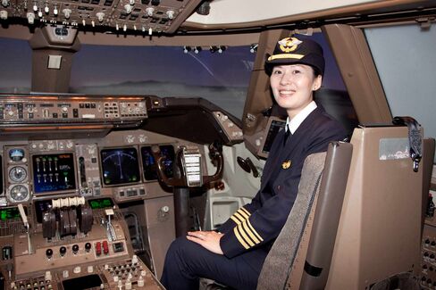 First Officer Sophia Kuo inside the cockpit of an EVA Airways Boeing 747.