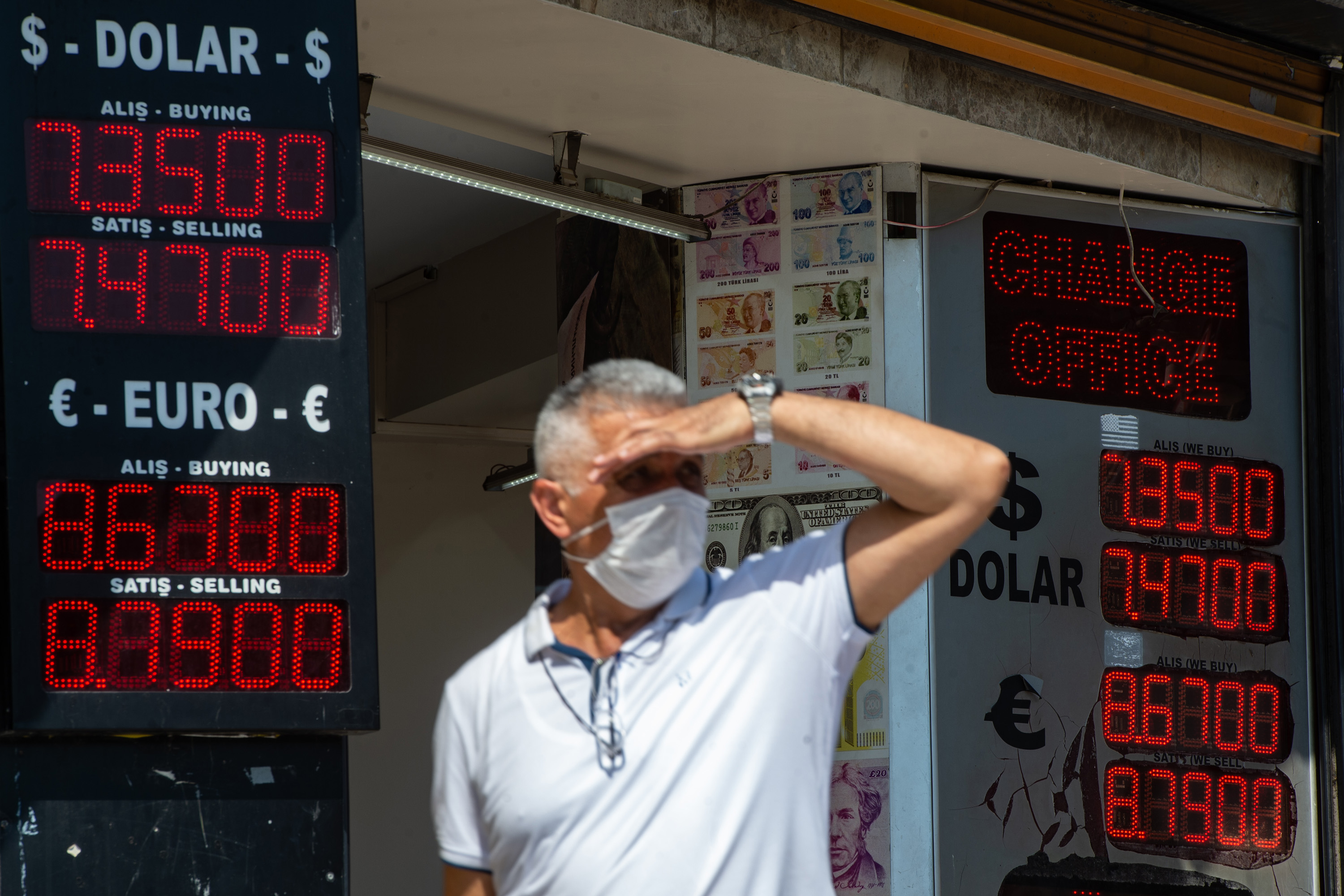 A man looks on outside&nbsp;a currency&nbsp;exchange in Istanbul, on Aug. 6.