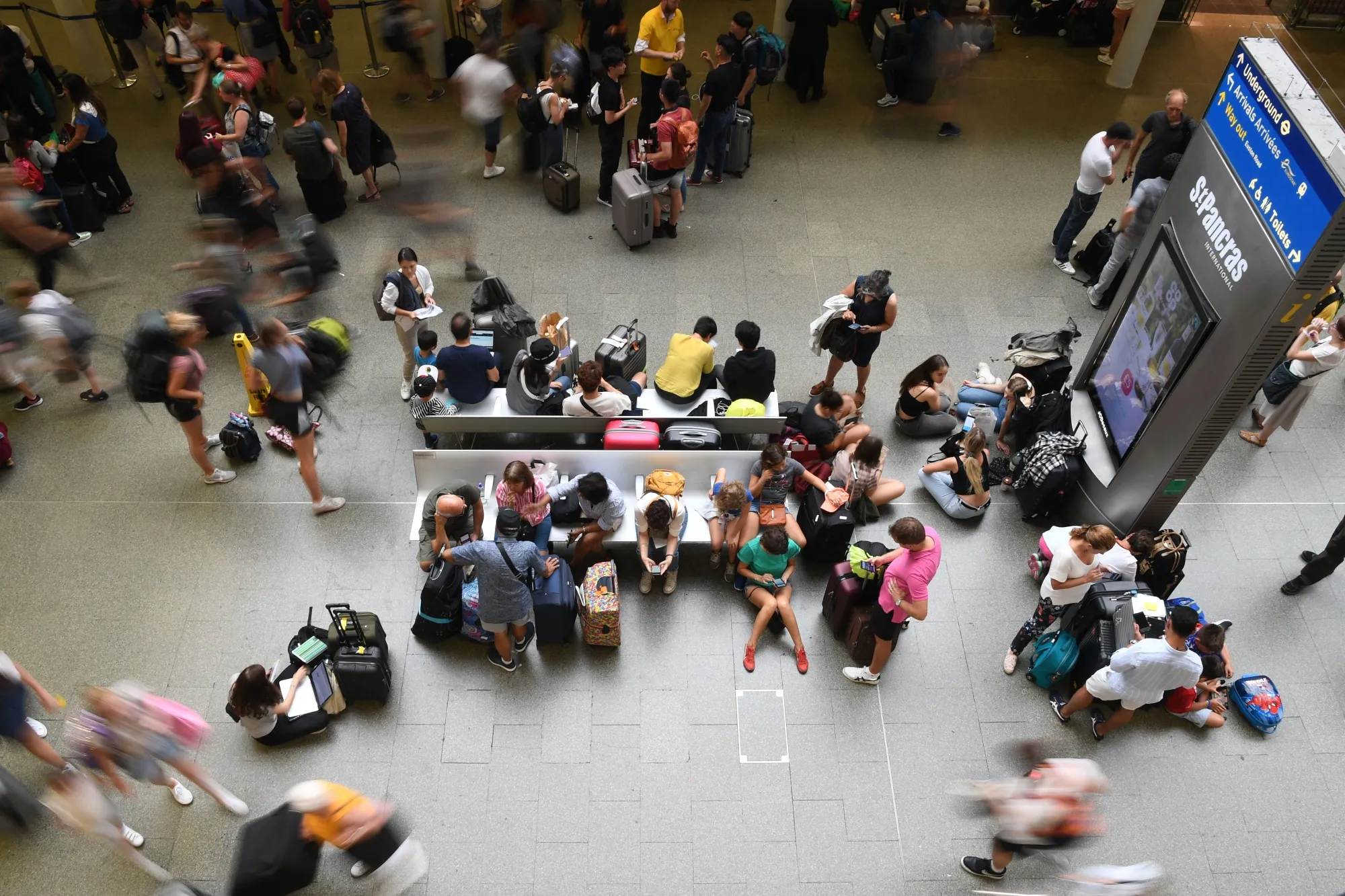 Passengers for the Eurostar wait at St. Pancras rail station in London.