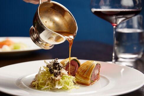 A gorgeous pigeon pie, finished with gravy at the table.