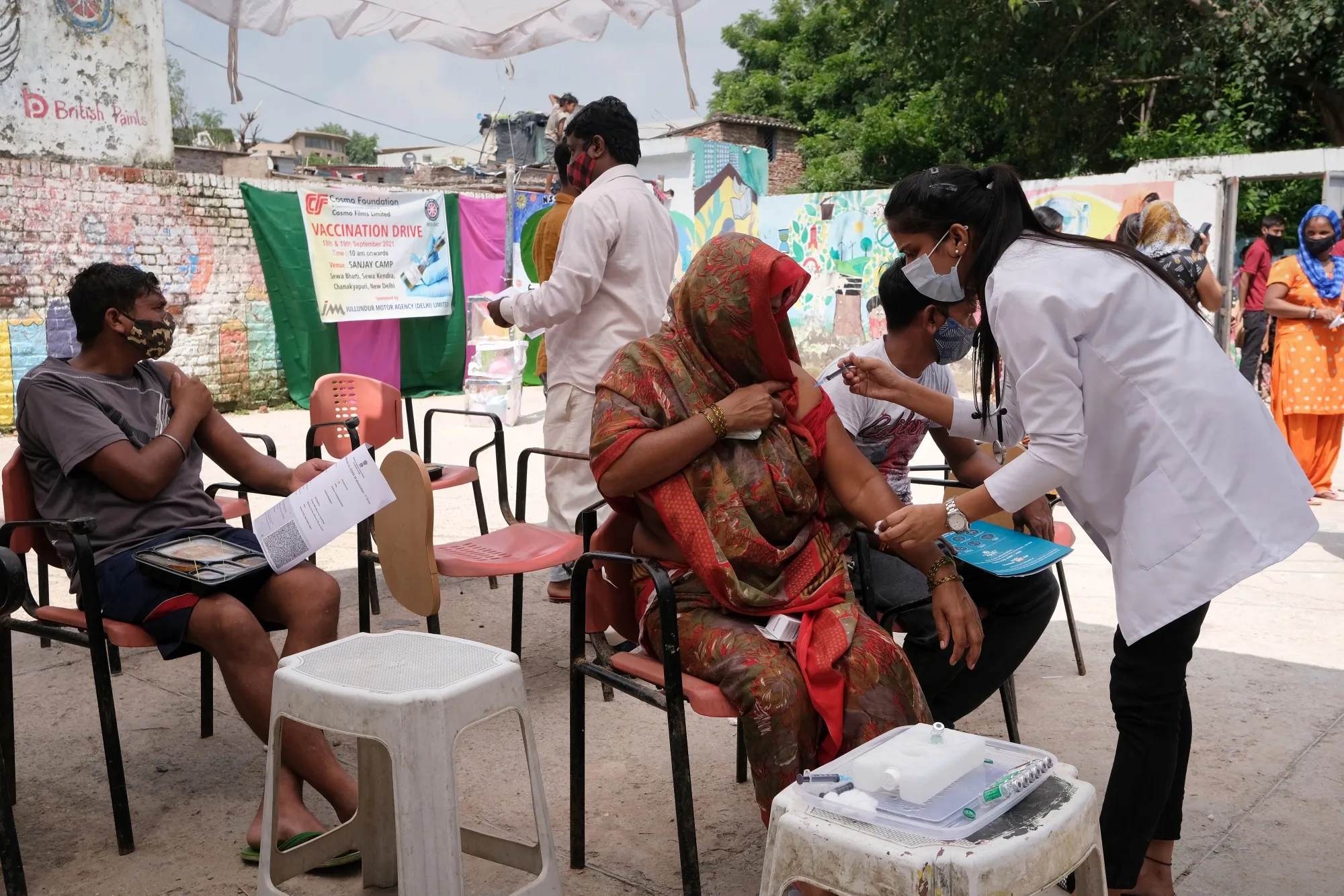 A health care worker administers a dose of the Covid-19 Covishield vaccine at a vaccination camp in New Delhi, on Sept. 19.