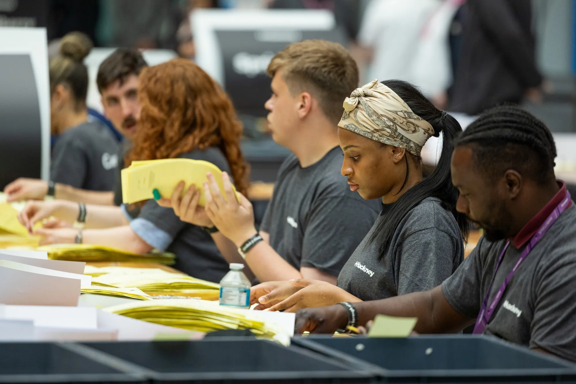 Workers counting votes at Hackney Town Hall following the local election in London, UK, on Friday, May 8, 2026. Prime Minister Keir Starmer said he had no plans to step aside as Labour leader after early results in local elections showed Nigel Farage’s populist Reform UK racking up sweeping gains over Britain’s governing party.