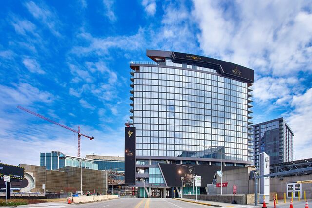 Exterior view of Hotel Phoenix with a glass facade. 