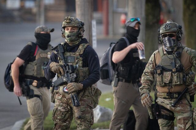 Federal immigration officers in a Chicago suburb in September where protesters gathered 