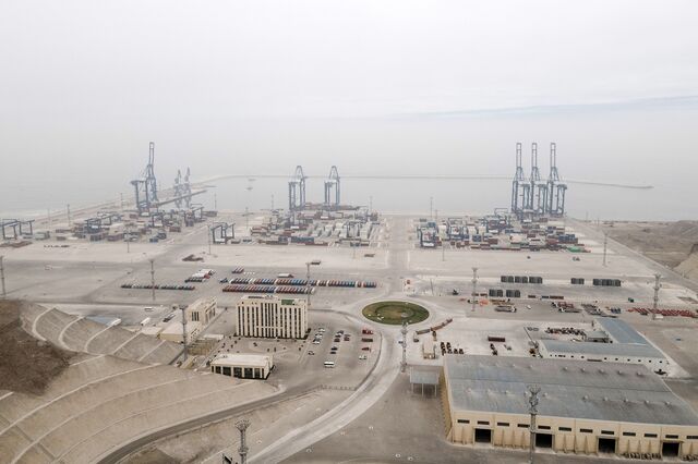 An aerial view of the port, with cranes in the background.
