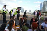 A coalition of climate activists hold a sit in on Waterloo Bridge in London, UK, on Oct. 1.
