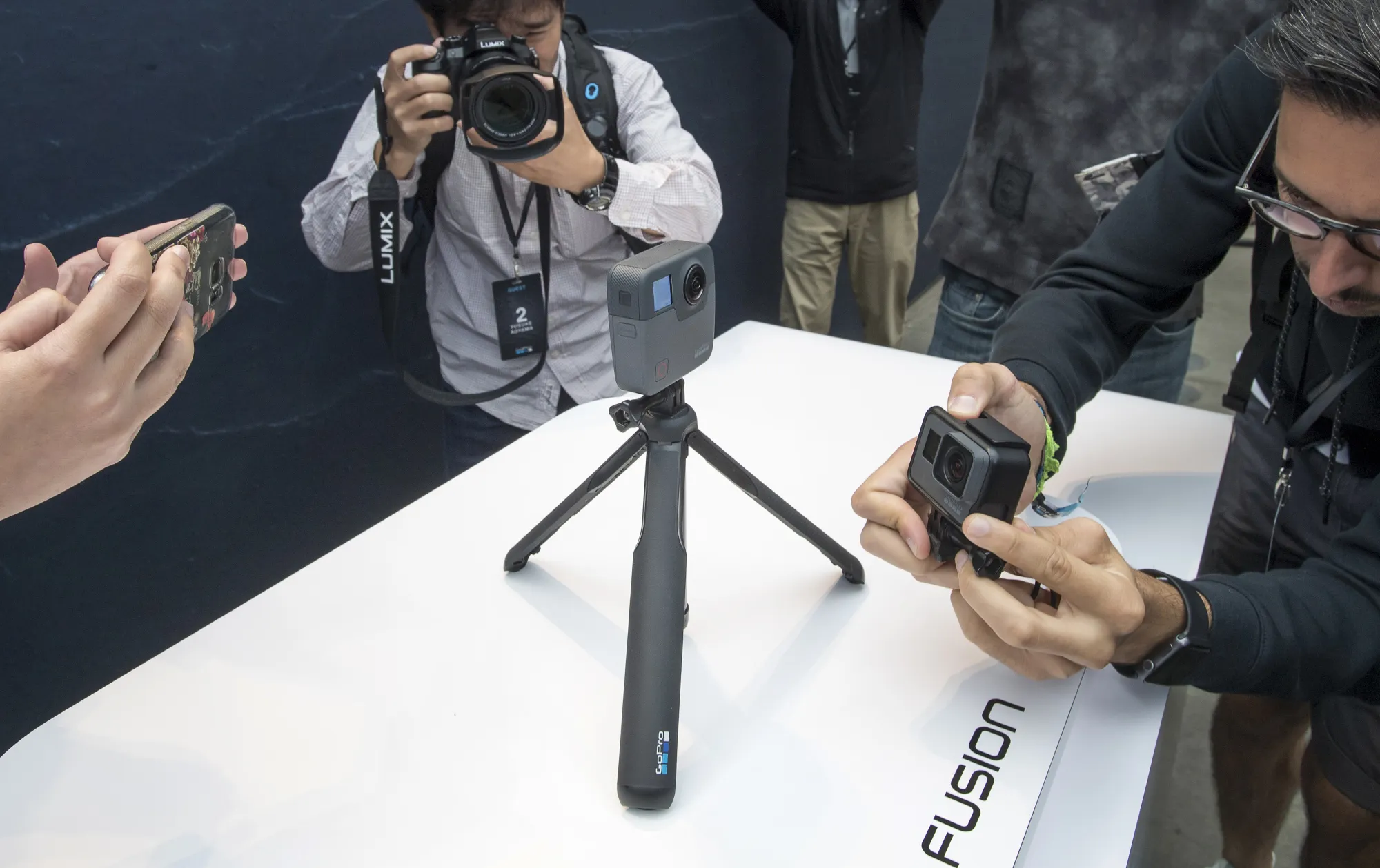 Attendees take photographs of the GoPro&nbsp;Fusion 360 camera during an event in San Francisco, California.