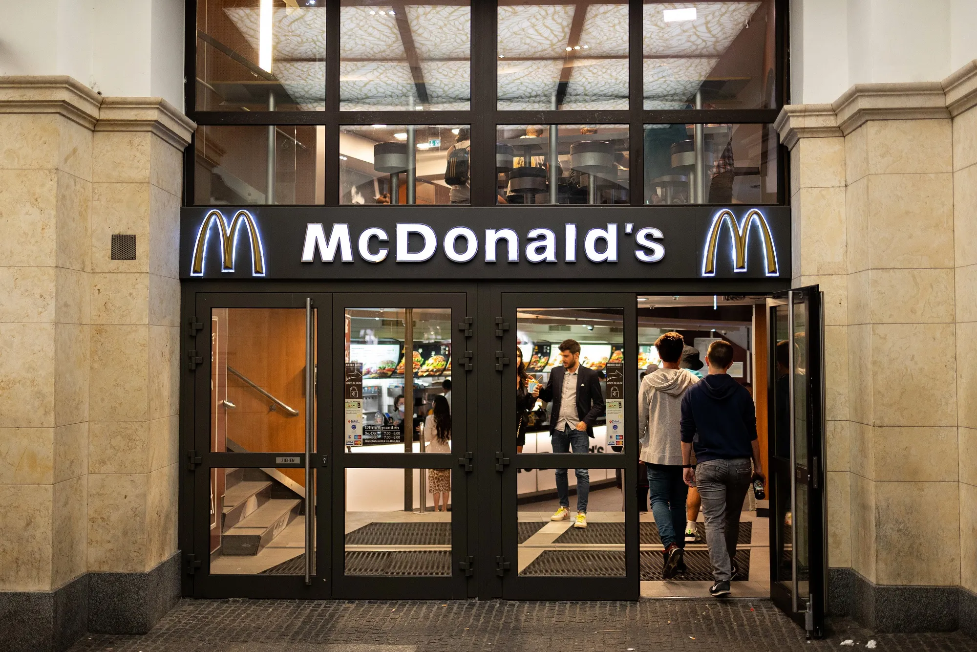 Customers enter a McDonalds Corp. restaurant in Munich, Germany.&nbsp;