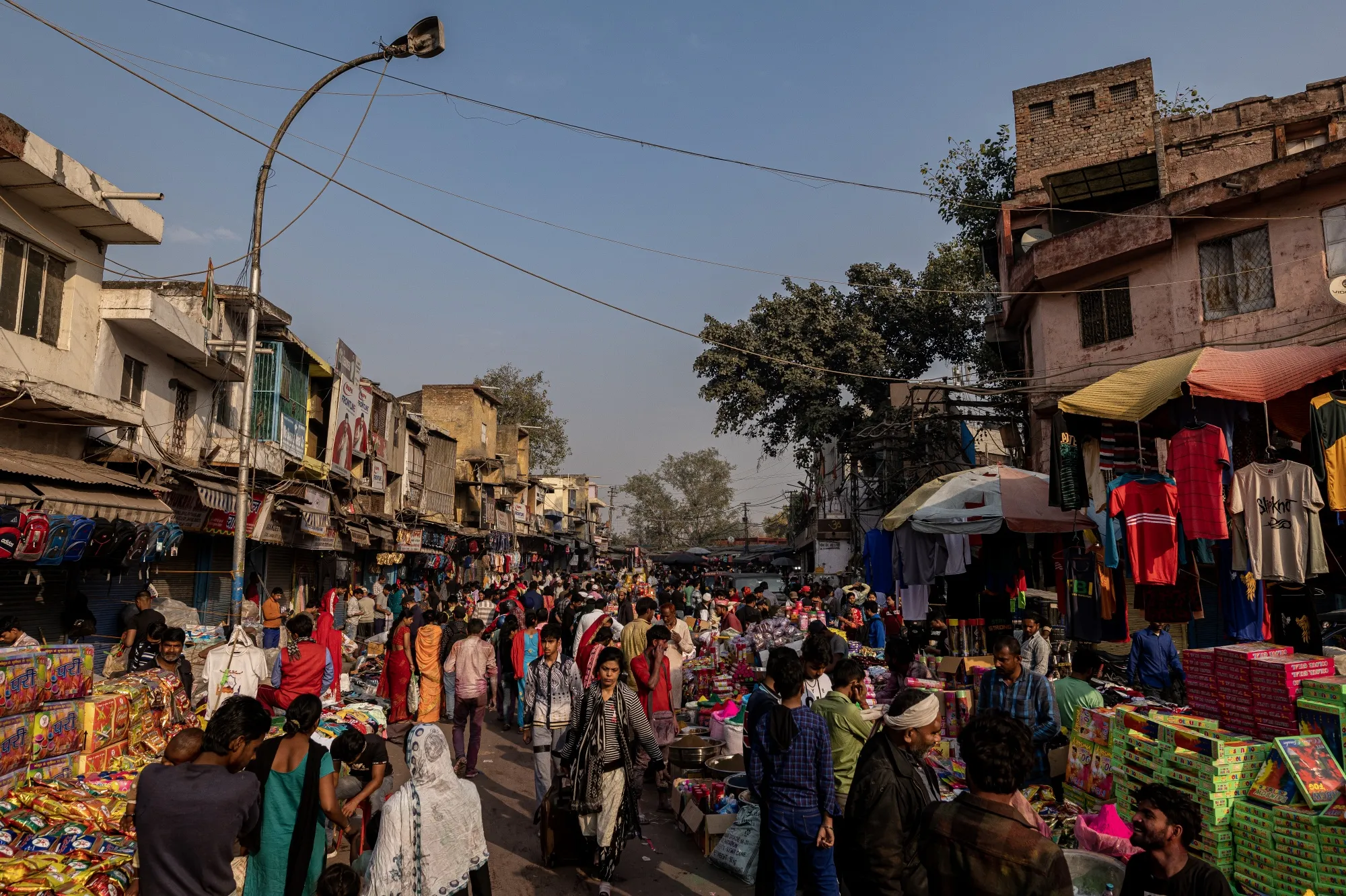 Shoppers crowd at a market in New Delhi, India.
