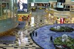 People walk through Changi Airport, Singapore.