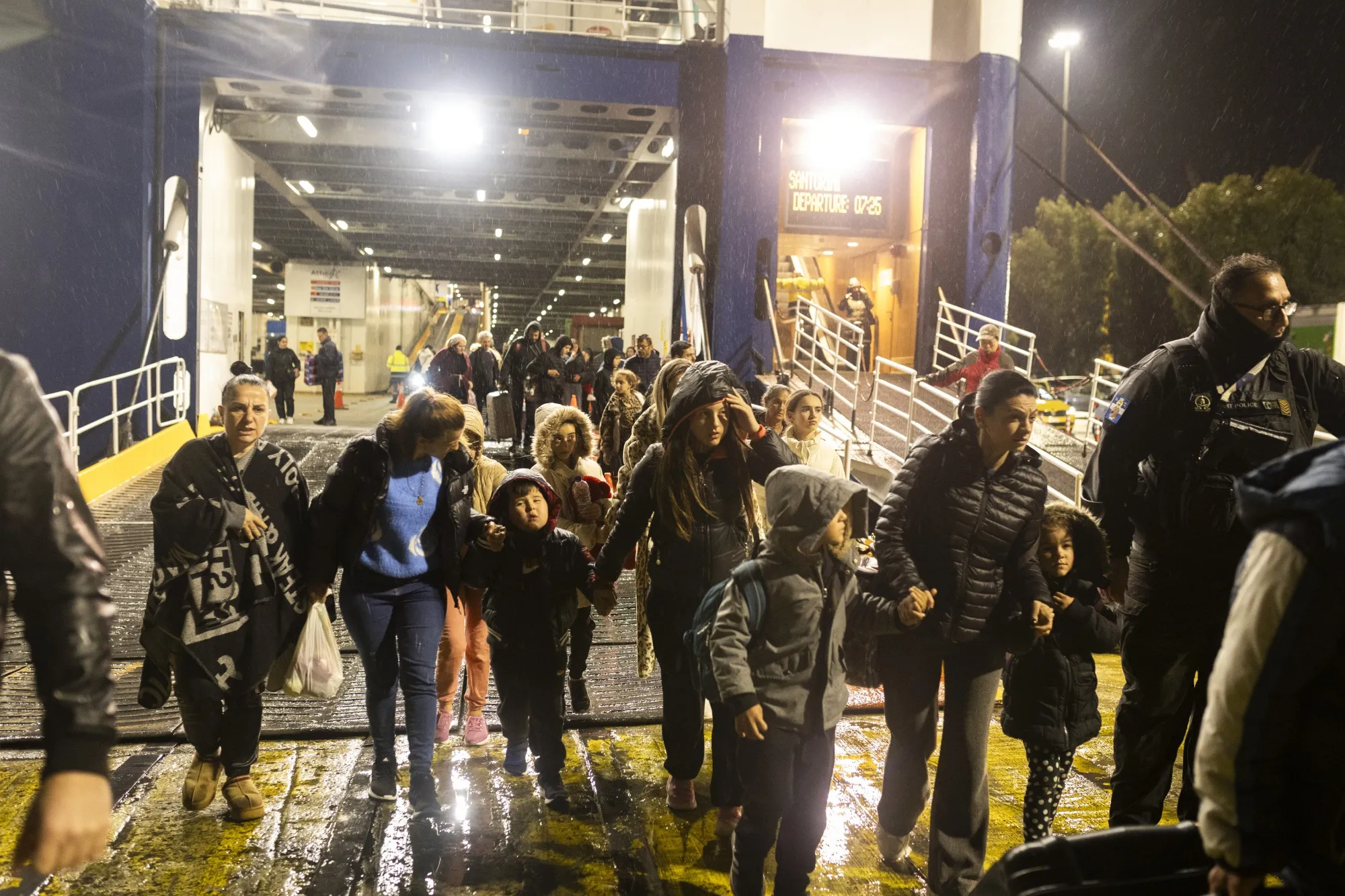 People disembark in Piraeus near Athens after leaving the Greek island of Santorini, on Feb. 4.