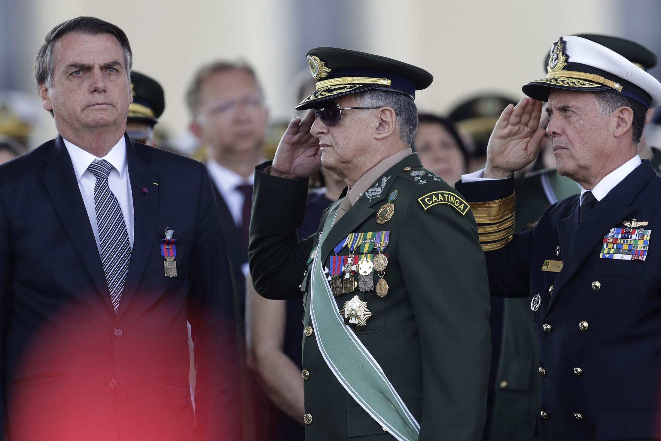 Brazil’s President Jair Bolsonaro, left, receives military honors during a ceremony for the Day of the Soldier&nbsp;at the Army Headquarters in Brasilia in August 2019.