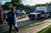 Houston Fire Department EMS medics transport a patient with possible COVID-19 symptoms to a hospital on Aug. 10.