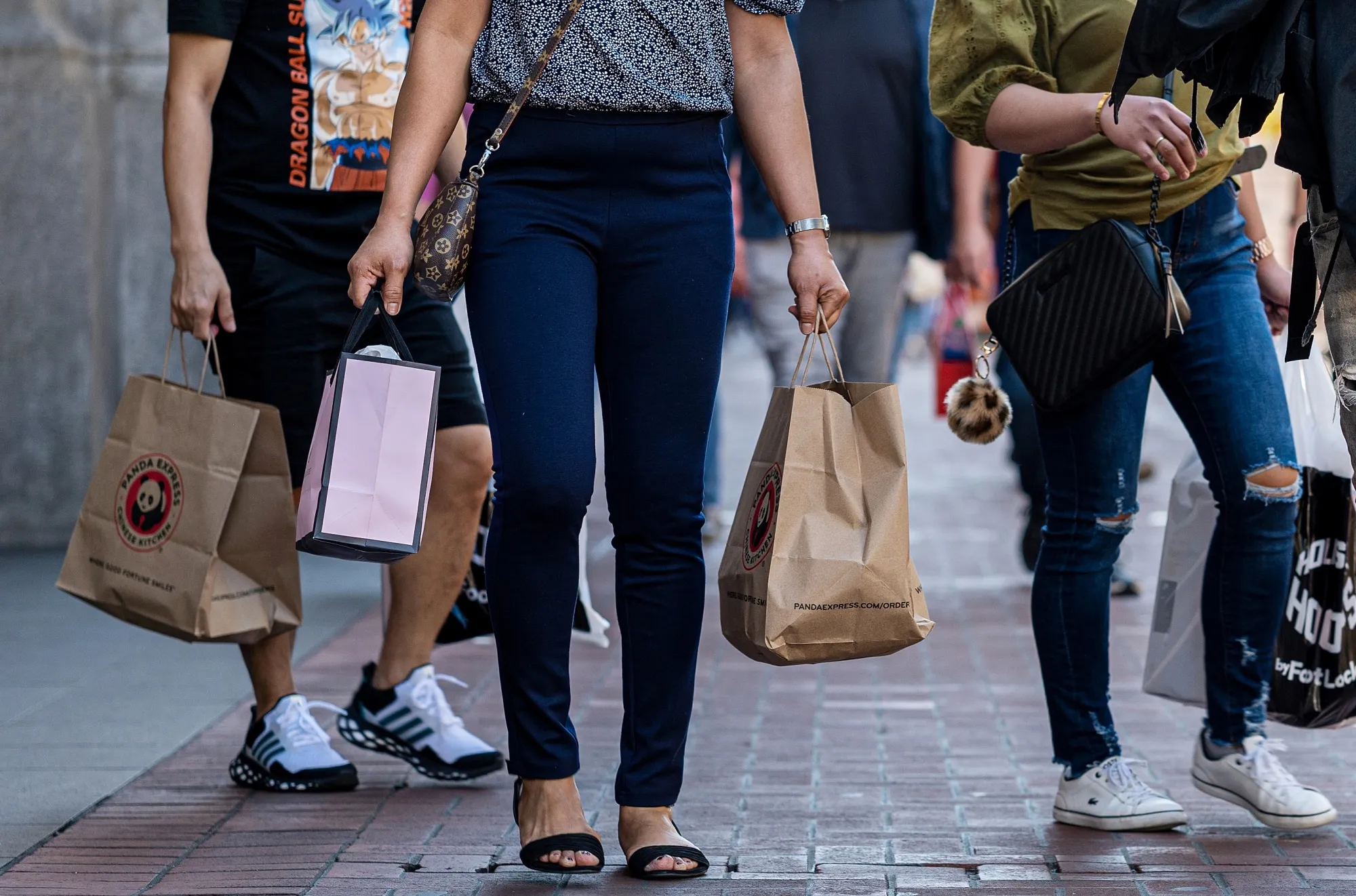 Shoppers carry bags in San Francisco on Sept. 29.