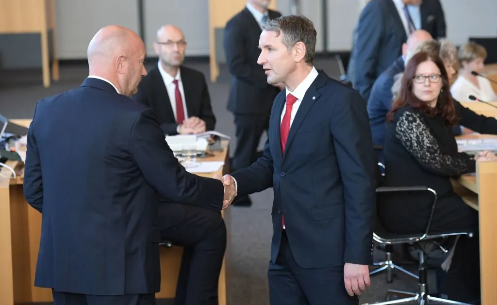 Hoecke of the AfD (right) congratulates the new state premier.