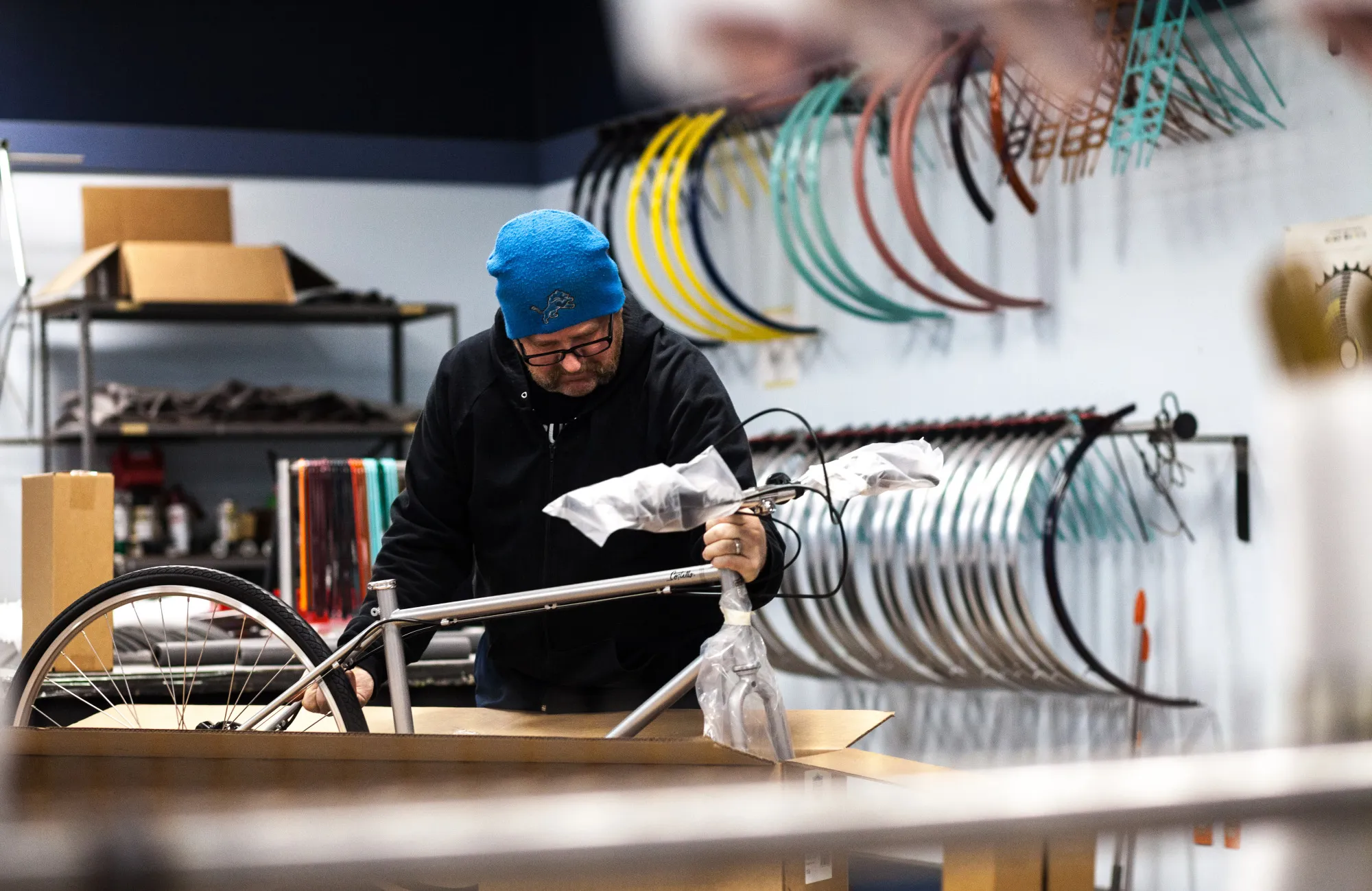 An employee assembles a bicycle at Detroit Bikes.