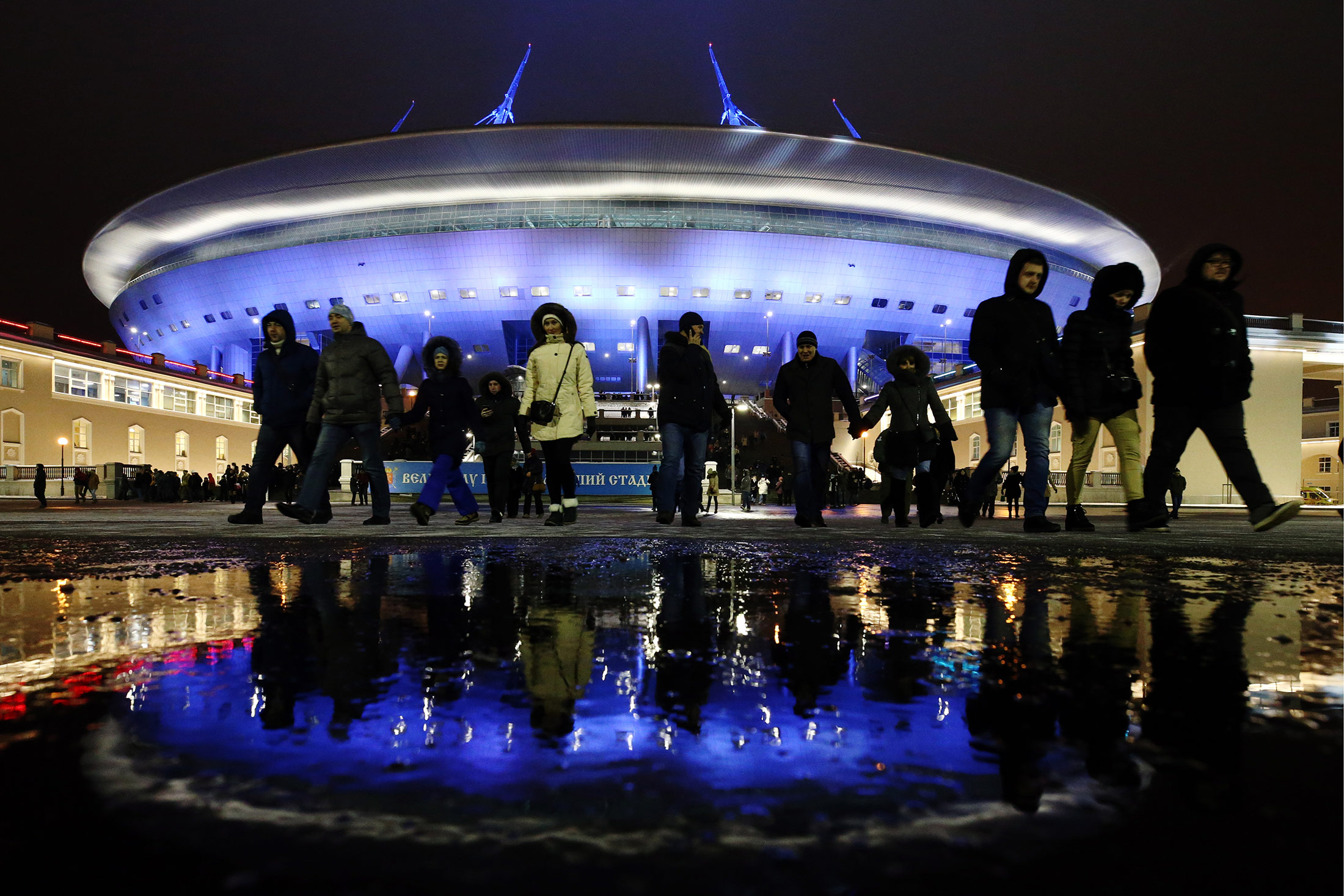 Locals gather by at Zenit Arena, a new stadium on Krestovsky Island in St Petersburg, as first spectators visit the stadium. Almost 10, 000 people test the stadium's readiness to host 2017 FIFA Confederations Cup and 2018 FIFA World Cup matches.
