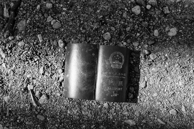 A Chinese passport is left behind with its pages torn out near a border crossing in Boulevard. 