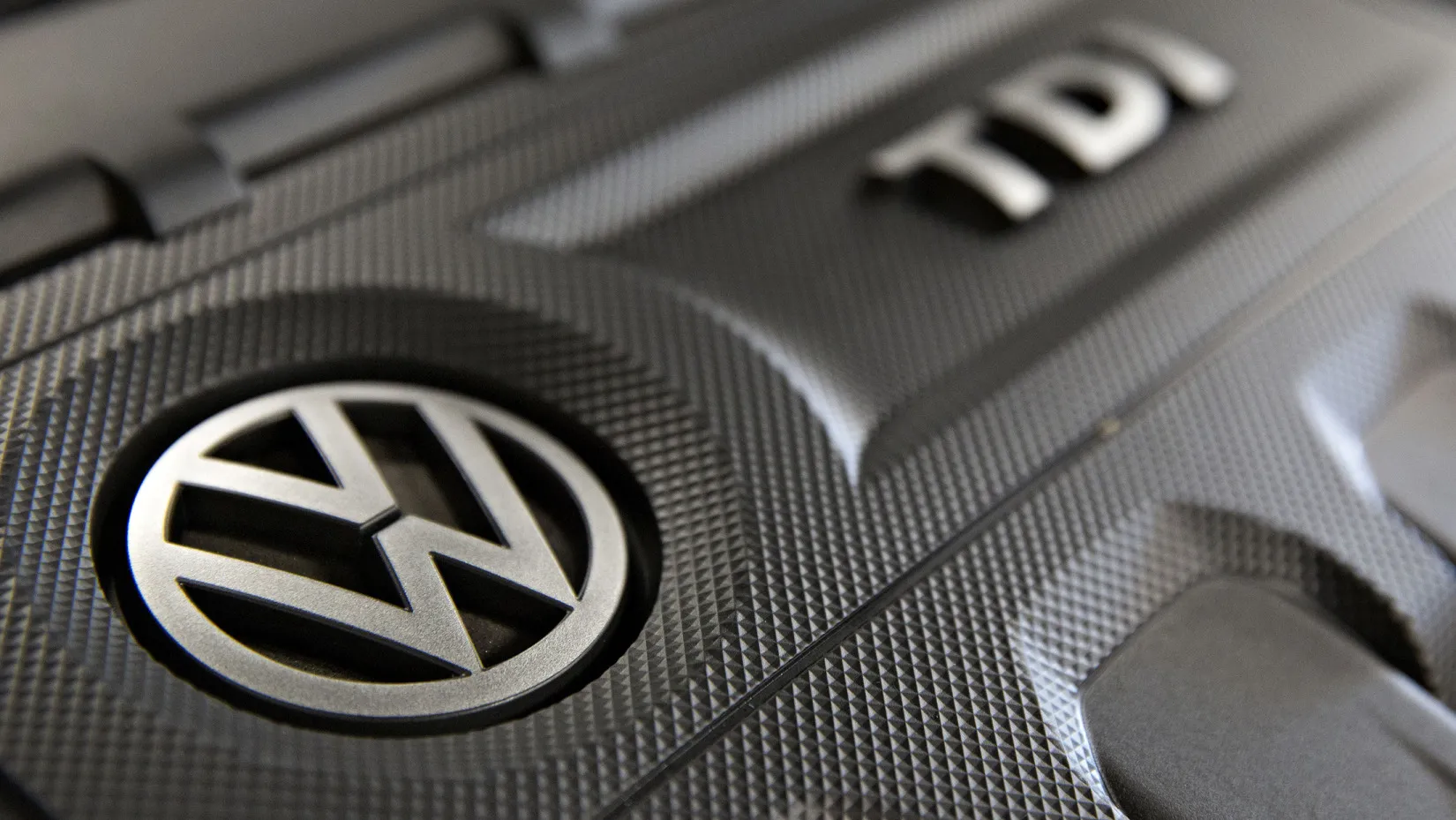 The Volkswagen AG logo appears on a 2.0L TDI diesel engine.
