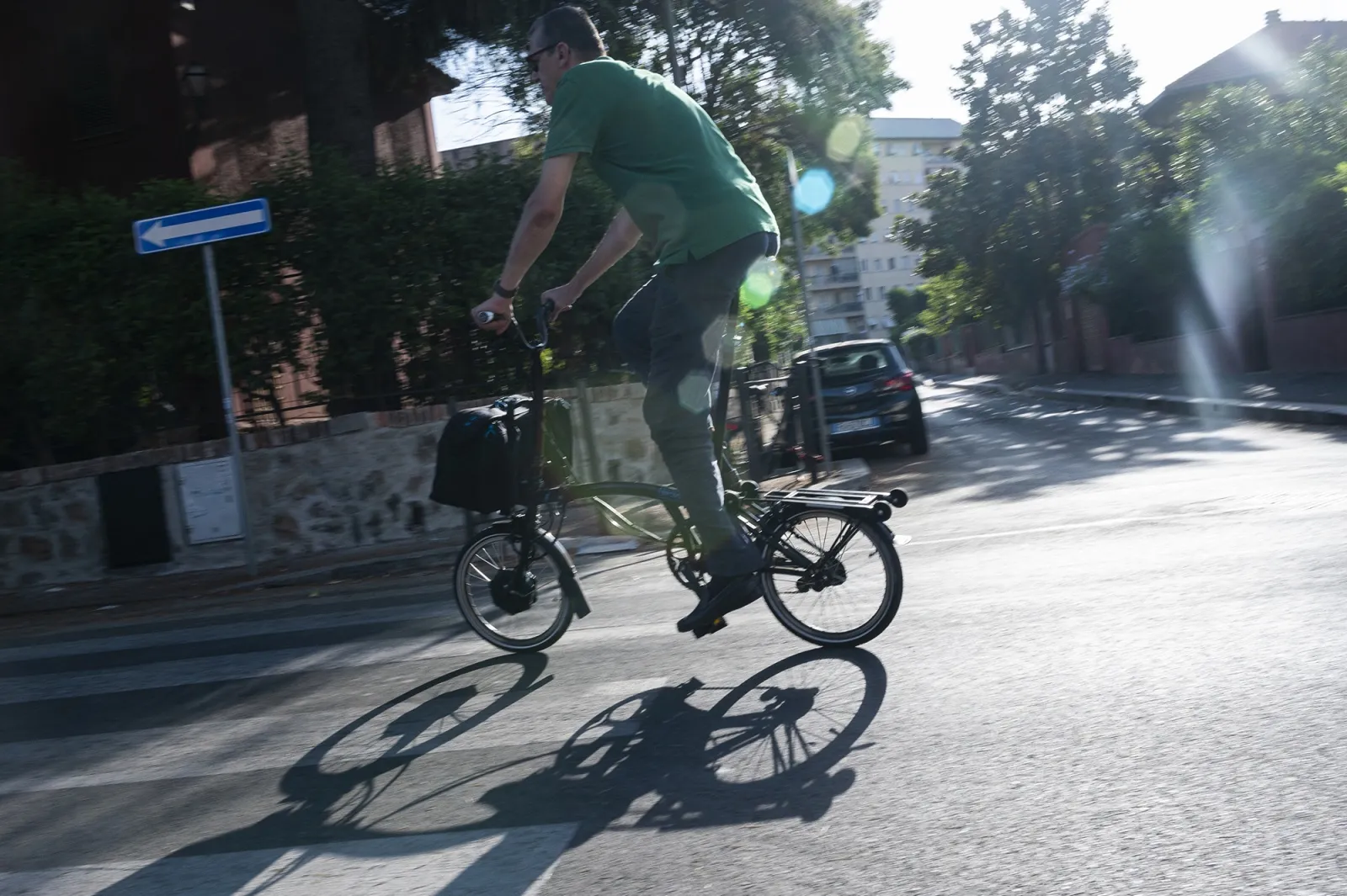 A commuter rides a foldable electric bicycle in Rome.