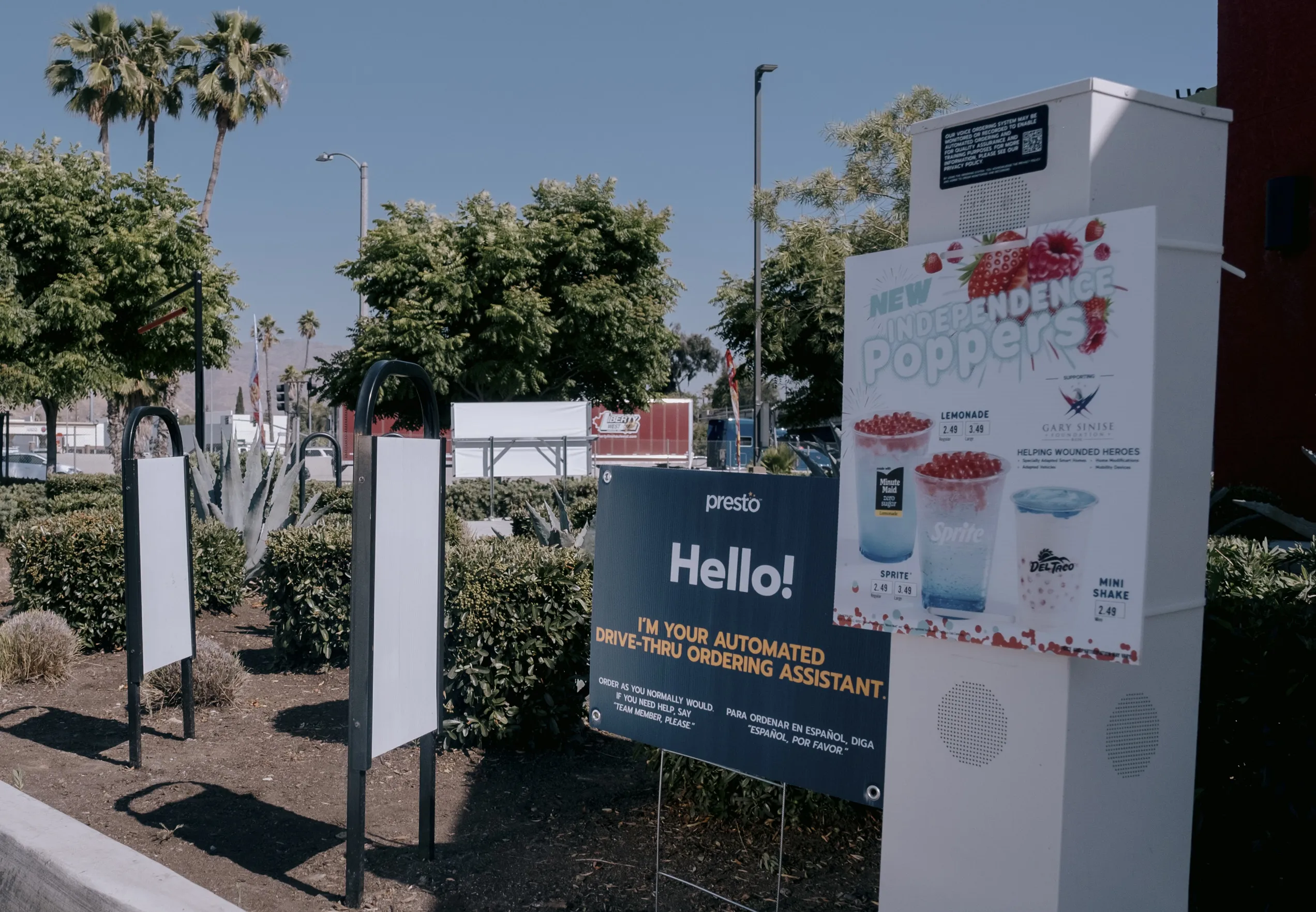 A sign at a Del Taco location in Riverside, California, tells customers to “order as you normally would” with the Presto Automation’s ordering assistant.